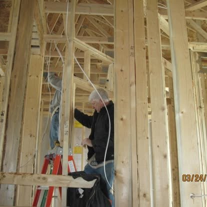 Electrical rough-in at a framed construction project